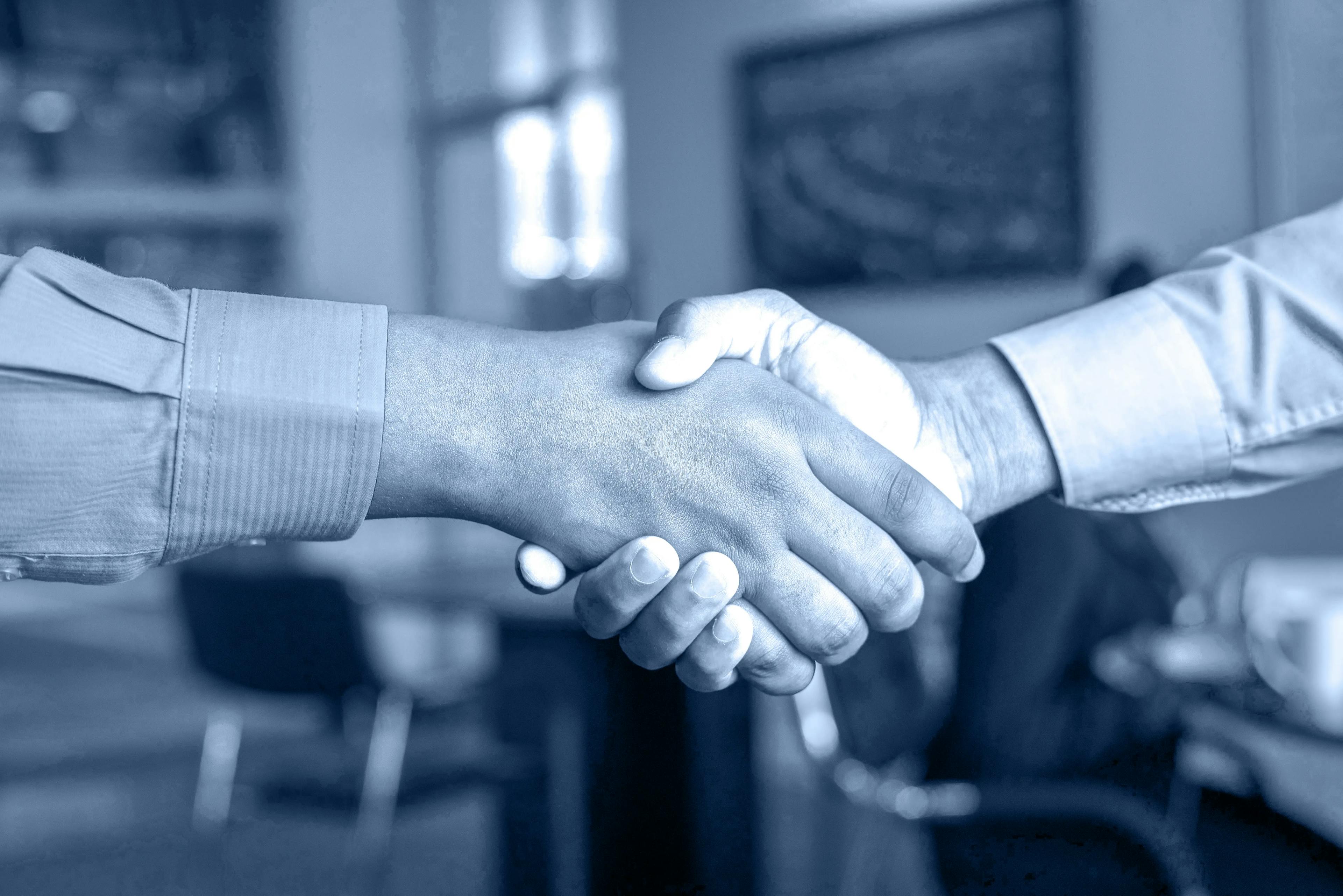 Business acquisition handshake